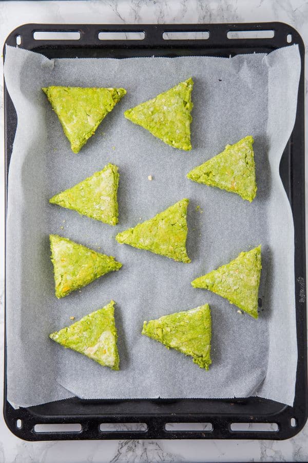 unbaked cut scones on tray.