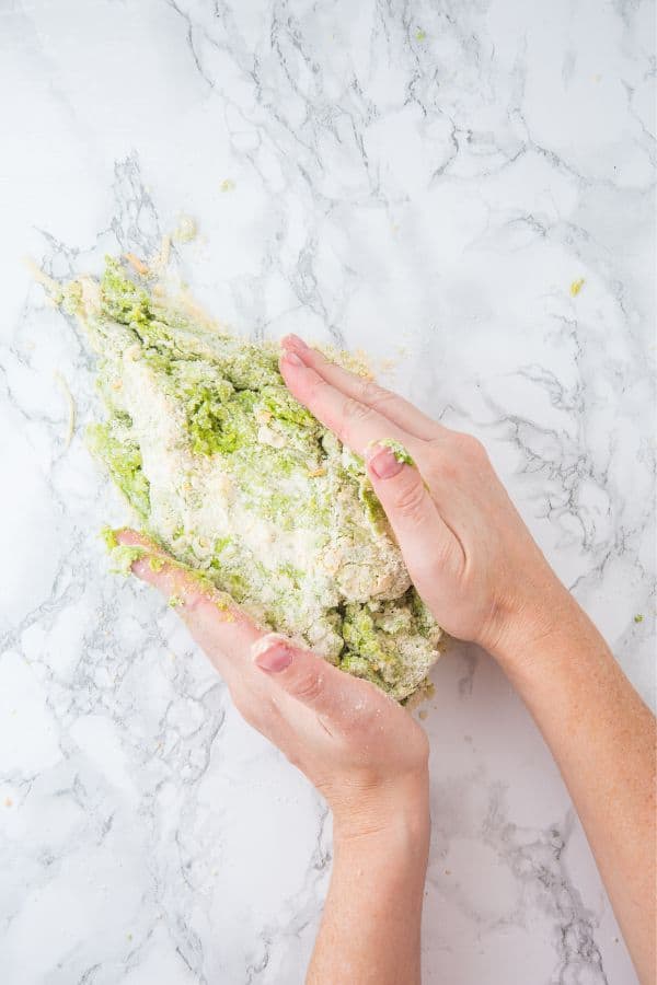 shaping cheese spinach scone dough.