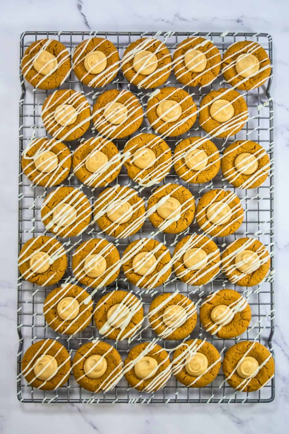 thumbprint cookies on wire rack.