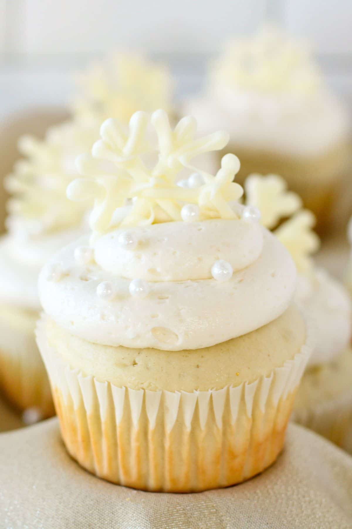 frosted cupcakes with winter wonderland toppers.